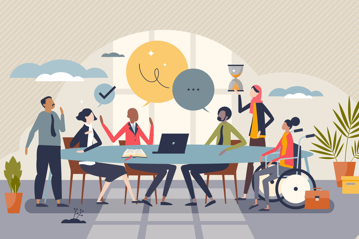 diverse group of people sitting around a work table