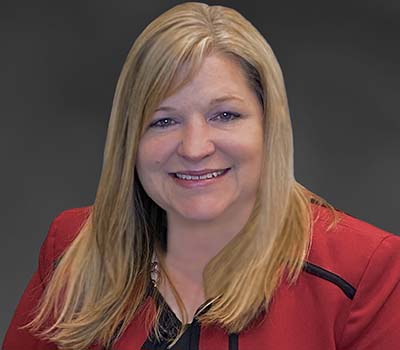 Shannon Berry's headshot gray background